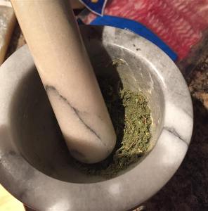 Grinding the sage and thyme