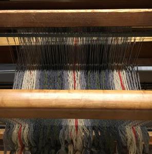 Threaded through the beater bar